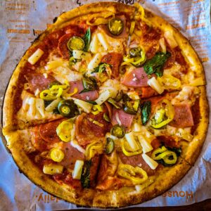 a pizza sitting on top of a piece of paper